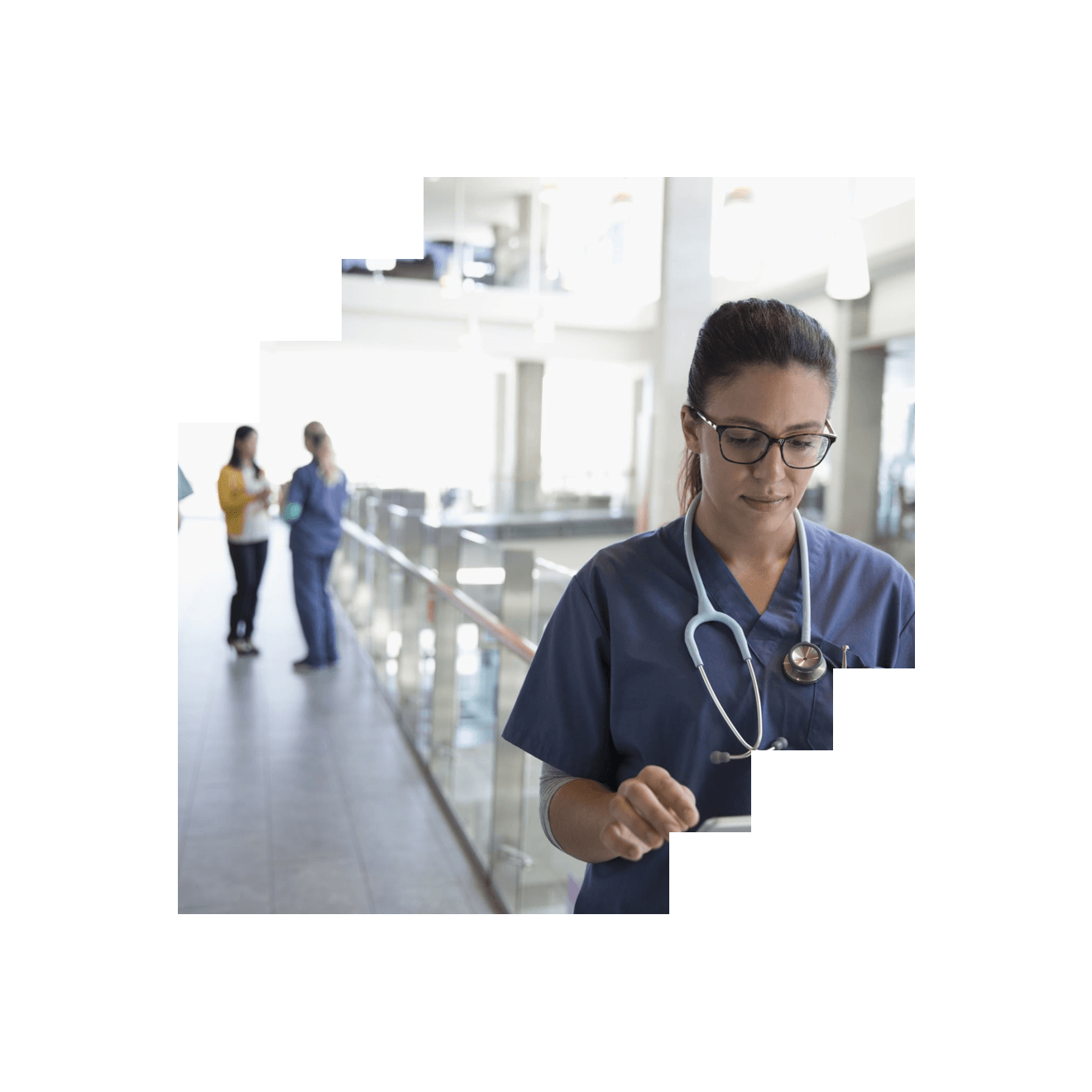 A nurse looking at documents in a hospital setting